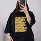 Oversized Drop Shoulder Graphic T-Shirt – Black “Impress Yourself” Text Print